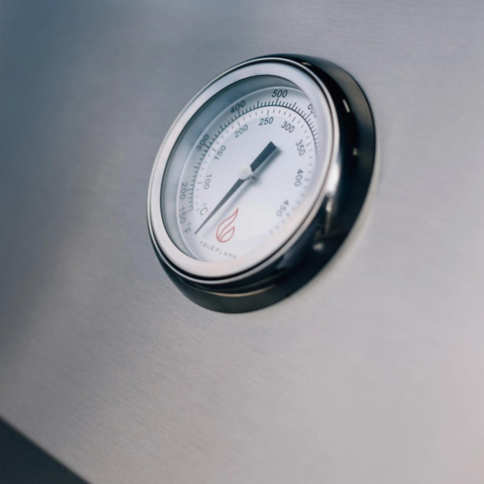 Close-up of the TrueFlame E-Series built-in gas grill hood-mounted analog temperature gauge.