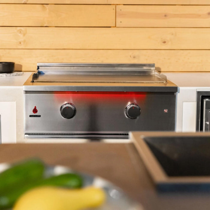 TrueFlame 30-inch built-in gas griddle installed in an outdoor kitchen with dual burner controls and LED lighting