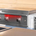 TrueFlame 30-inch built-in gas griddle with stainless steel lid closed in a premium outdoor kitchen installation