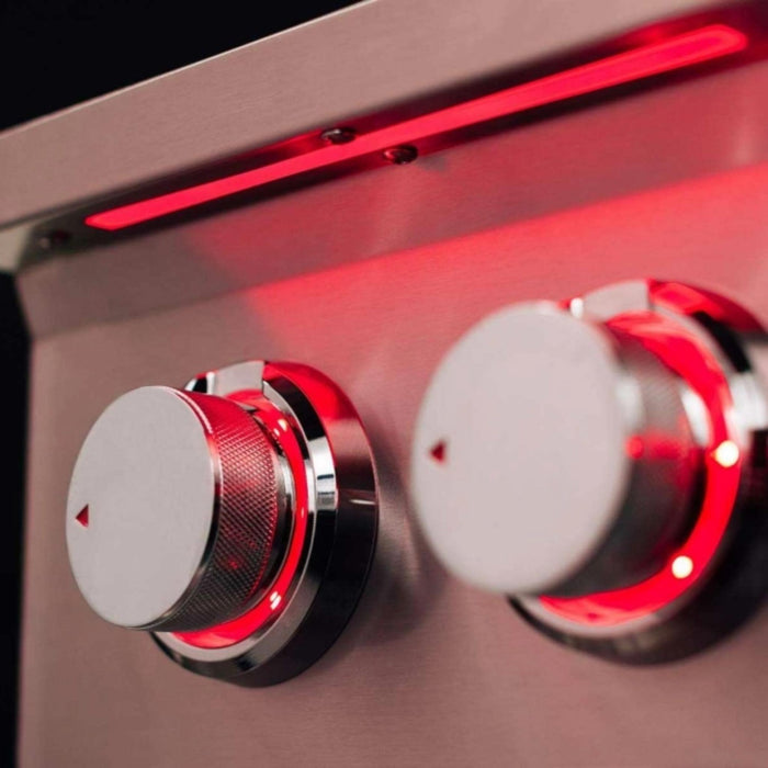 Close-up of TrueFlame power burner control knobs with red LED illumination and full-length exterior LED light bar.
