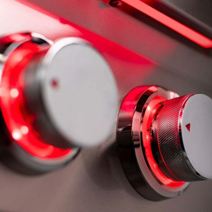 Close-up of TrueFlame Double Side Burner control knobs with red LED illumination
