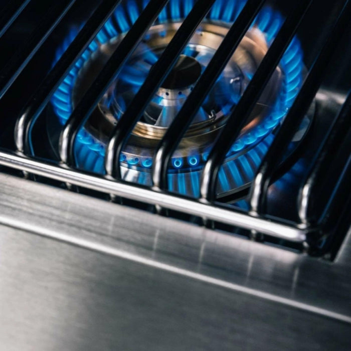 TrueFlame Double Side Burner ring burner with blue gas flame beneath stainless steel cooking grate