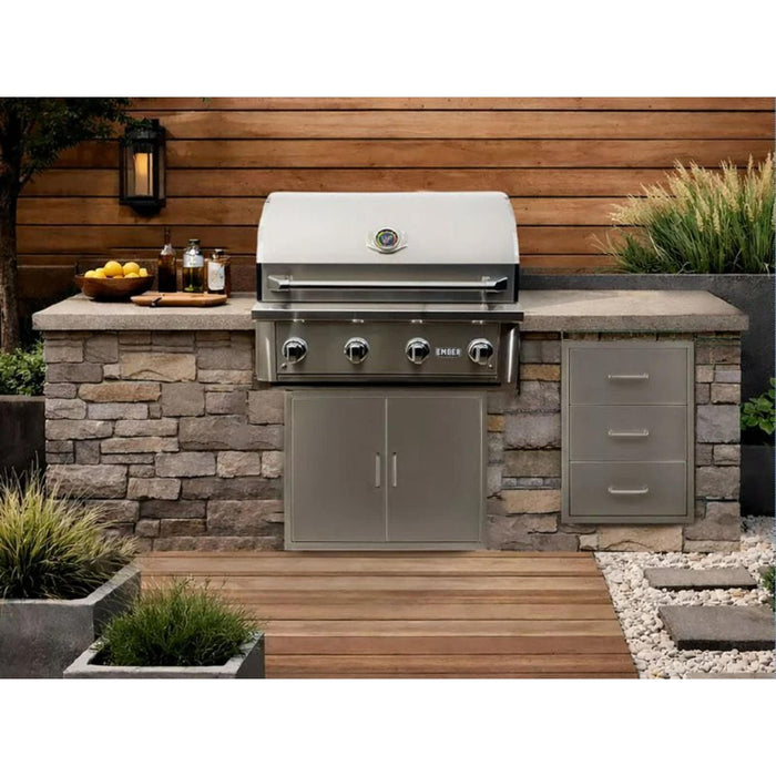 Wildfire Ember 32-inch stainless steel built-in gas grill installed in stone outdoor kitchen island